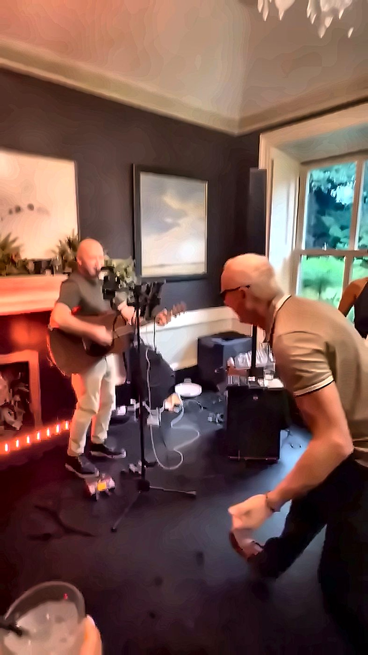 Liam Byrne performing on guitar