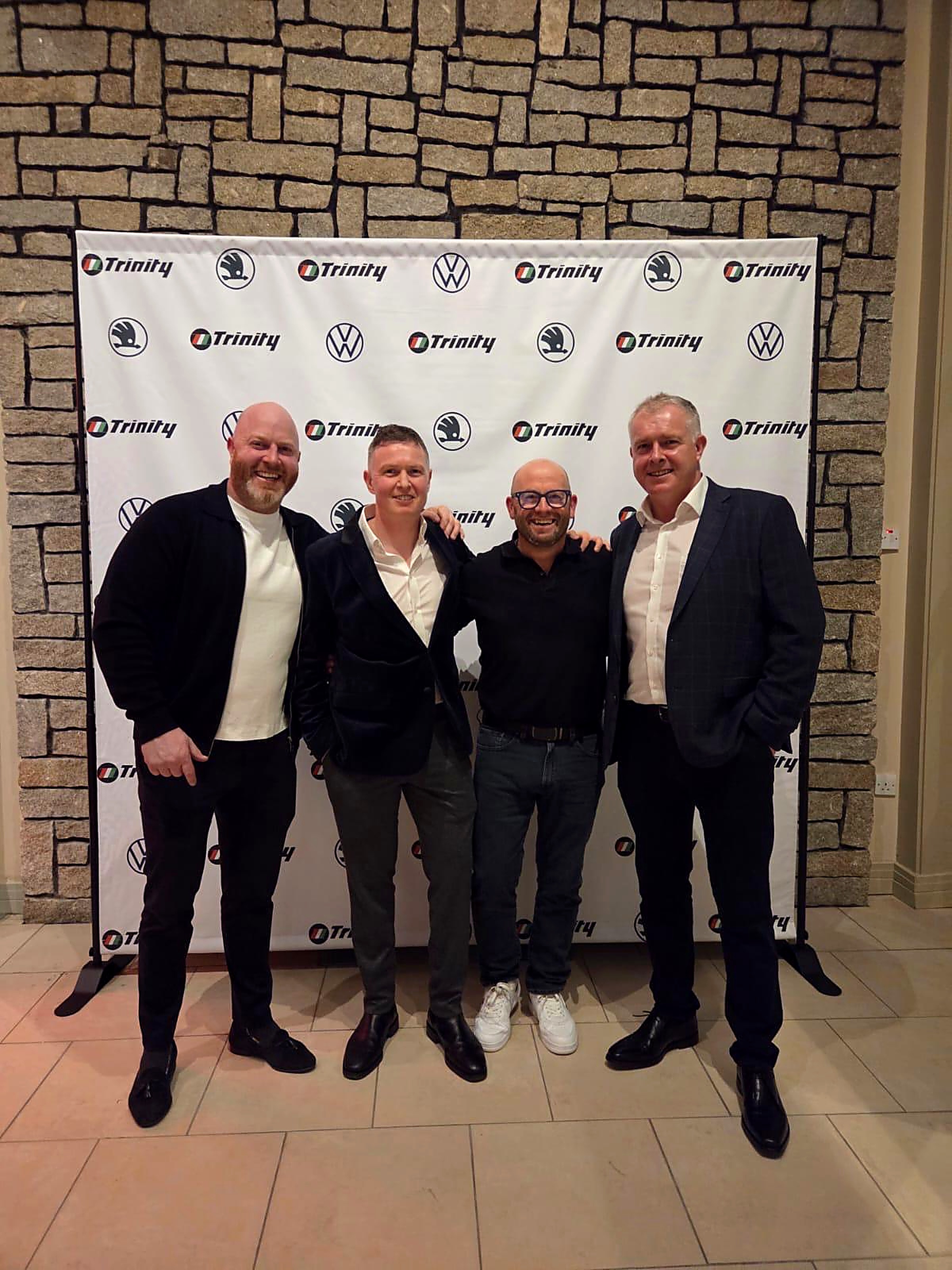 Liam Byrne with guests at a corporate event